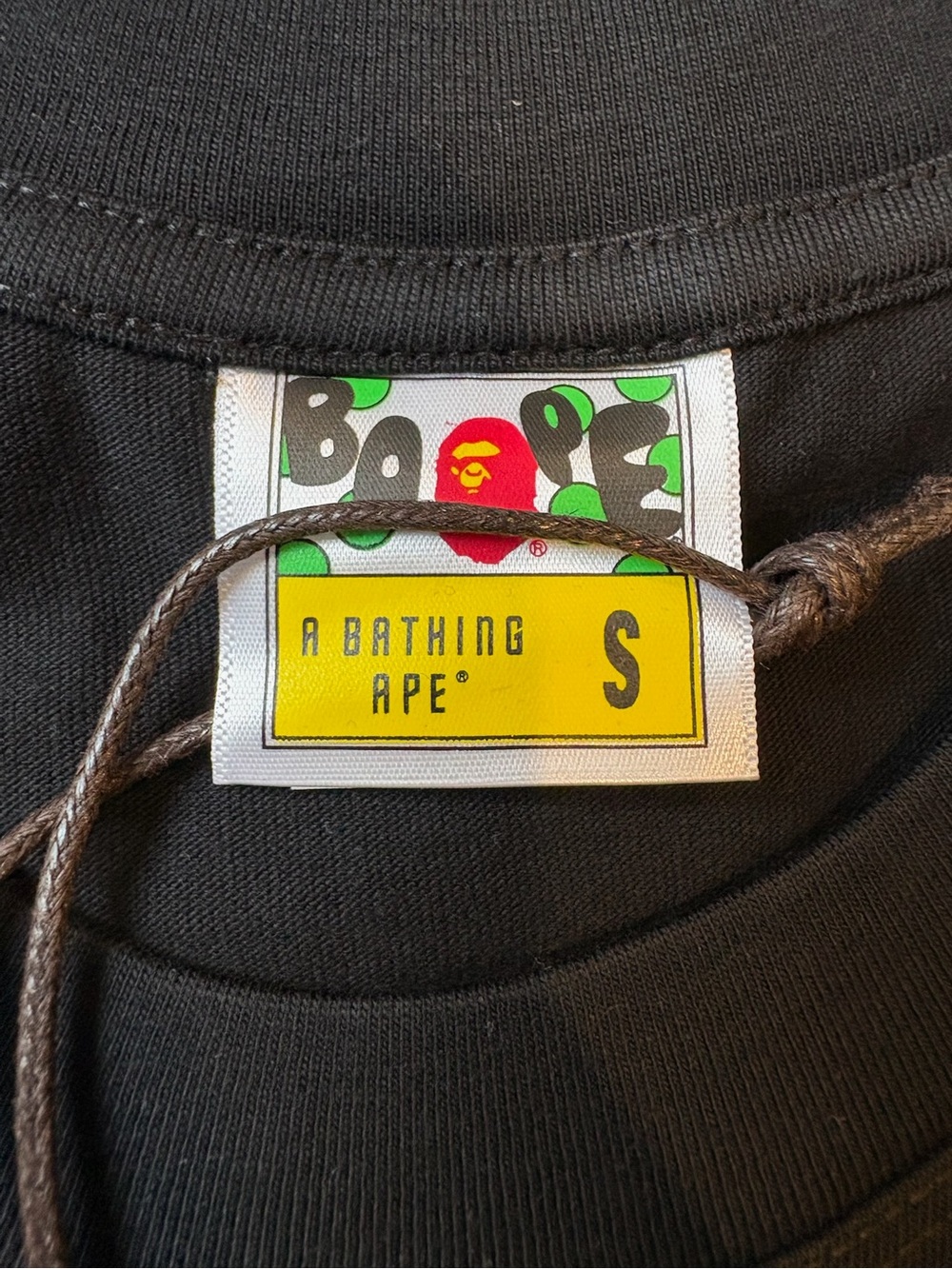 Bape Black Short-Sleeve Tee with Small Yellow Ape Head Chest Logo - Picture 4 of 9